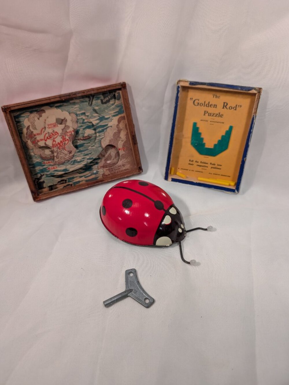 3 VINTAGE TOYS 2 DEXTERITY PUZZLES 1 TIN WIND UP TOY
